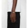 Graviertes Kettenarmband mit Karomuster